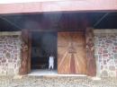 Church Entrance: The beautiful wooden doors at the entrance to the Taiohae church.  Carvings alongside the doors.